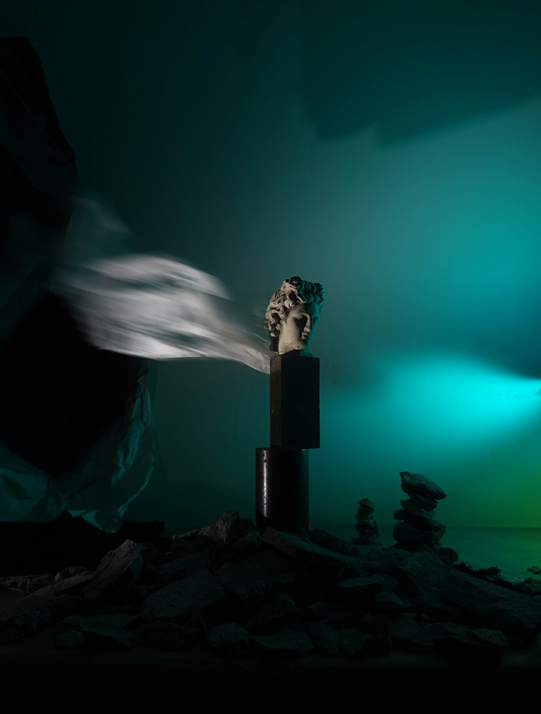 surrealism, classical sculpture, Apollo head, winged sculpture, cairn, dreamlike, dreamscape, dream shore
